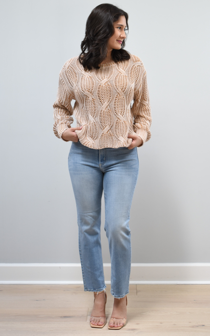 Heritage Cotton Cable Sweater on soft linen background, featuring 100% cotton knit with cable and ribbed texture.