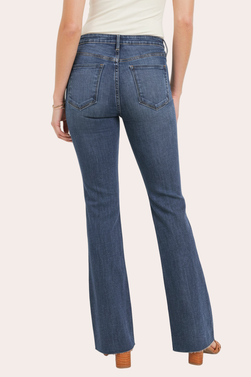 Dark-wash high-rise flare jeans with clean finish — flattering retro silhouette from Justyna Grace Boutique.