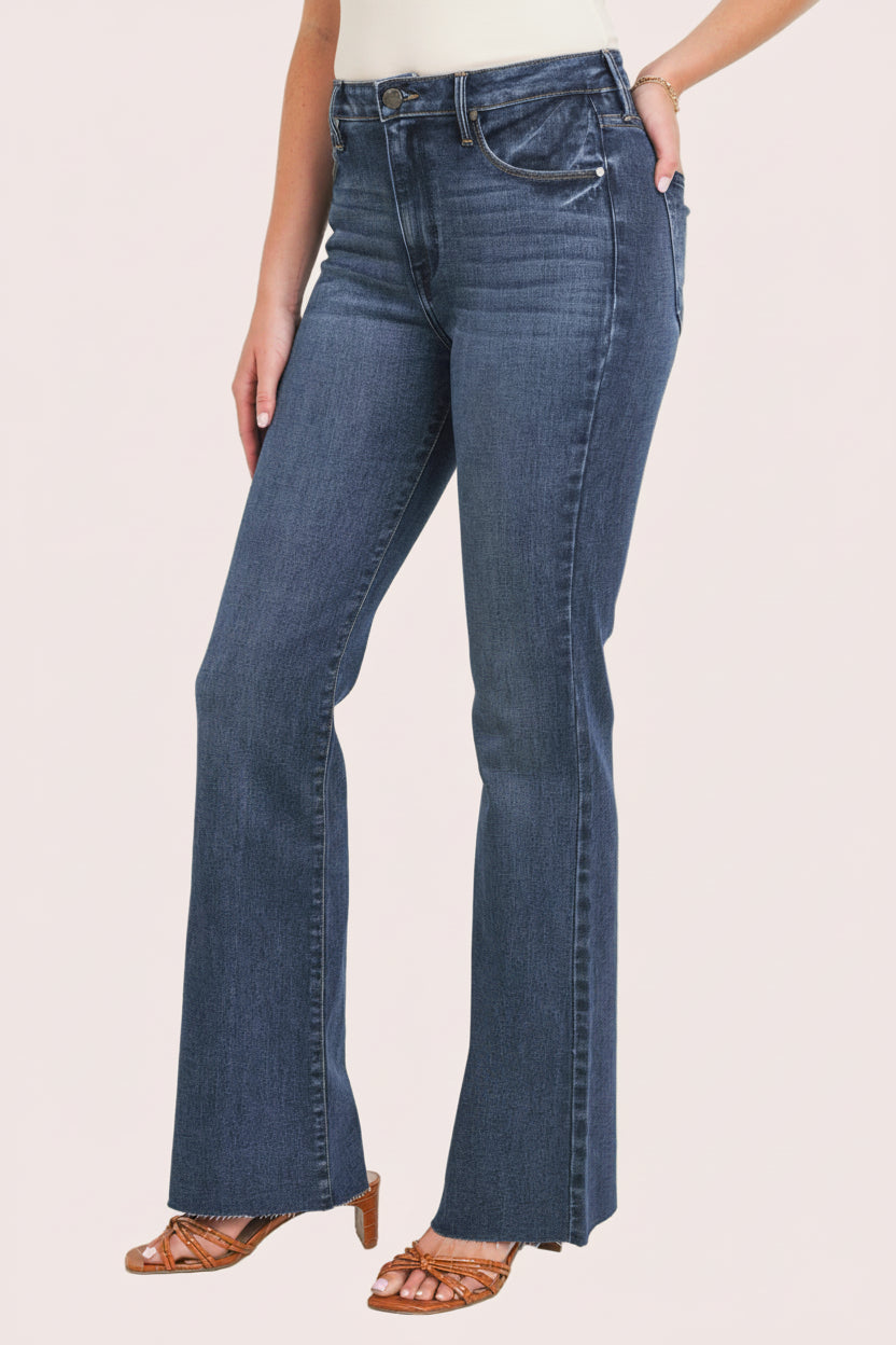 Dark-wash high-rise flare jeans with clean finish — flattering retro silhouette from Justyna Grace Boutique.