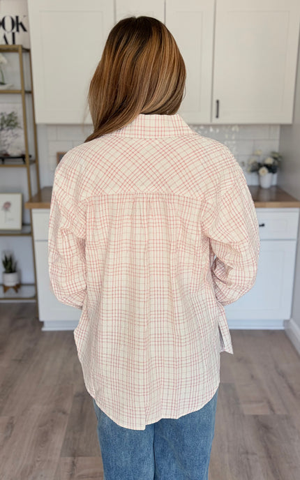 Model wearing Hollis oversized plaid cotton button down shirt layered over tank