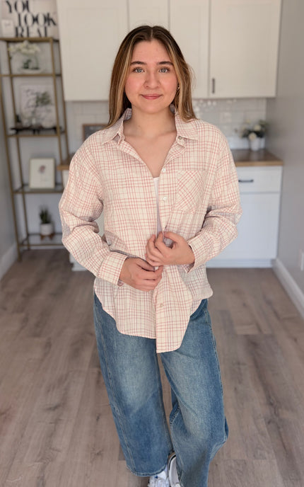 Model wearing Hollis oversized plaid cotton button down shirt layered over tank