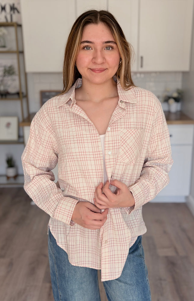 Model wearing Hollis oversized plaid cotton button down shirt layered over tank