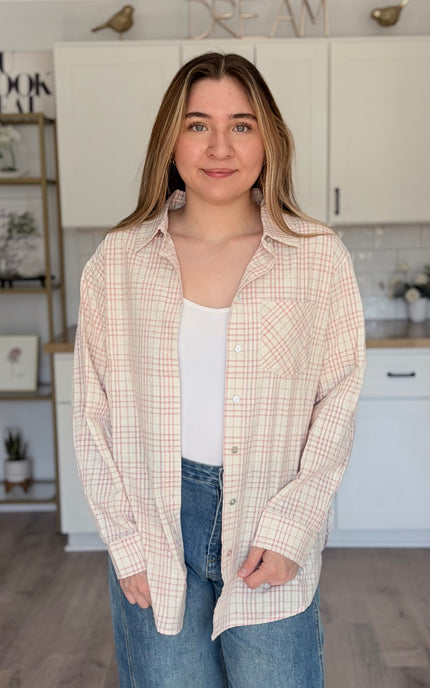Model wearing Hollis oversized plaid cotton button down shirt layered over tank