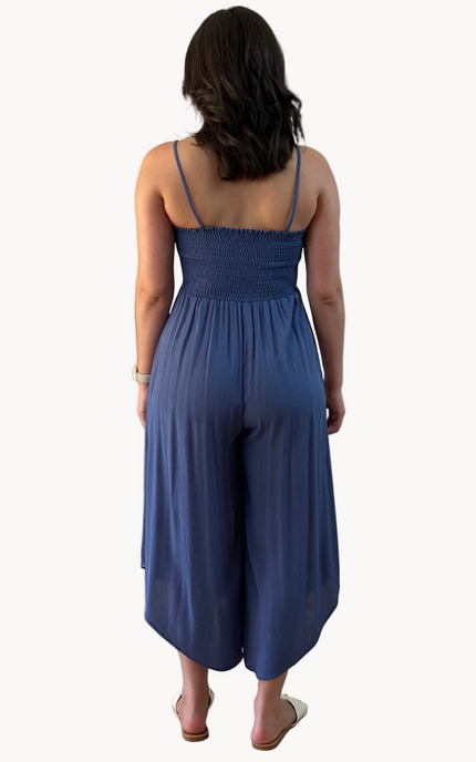 Isla Jumpsuit — woven solid fabric with ruched front and round midi hemline from Justyna Grace Boutique.