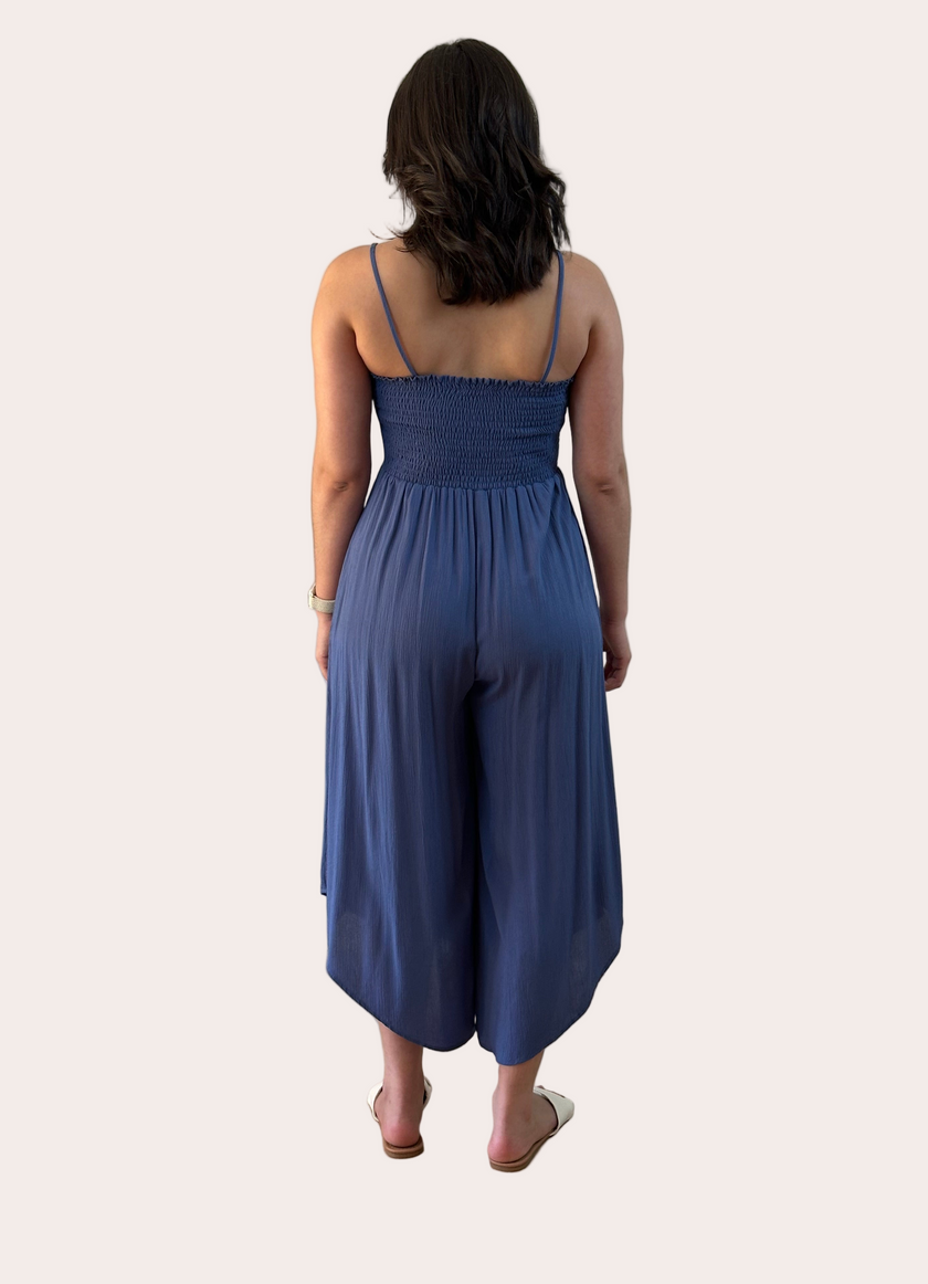 Isla Jumpsuit — woven solid fabric with ruched front and round midi hemline from Justyna Grace Boutique.