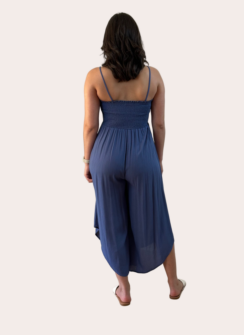 Isla Jumpsuit — woven solid fabric with ruched front and round midi hemline from Justyna Grace Boutique.