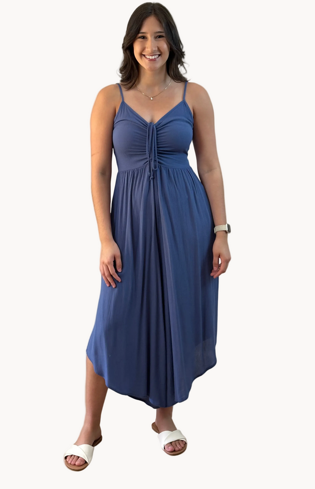 Isla Jumpsuit — woven solid fabric with ruched front and round midi hemline from Justyna Grace Boutique.