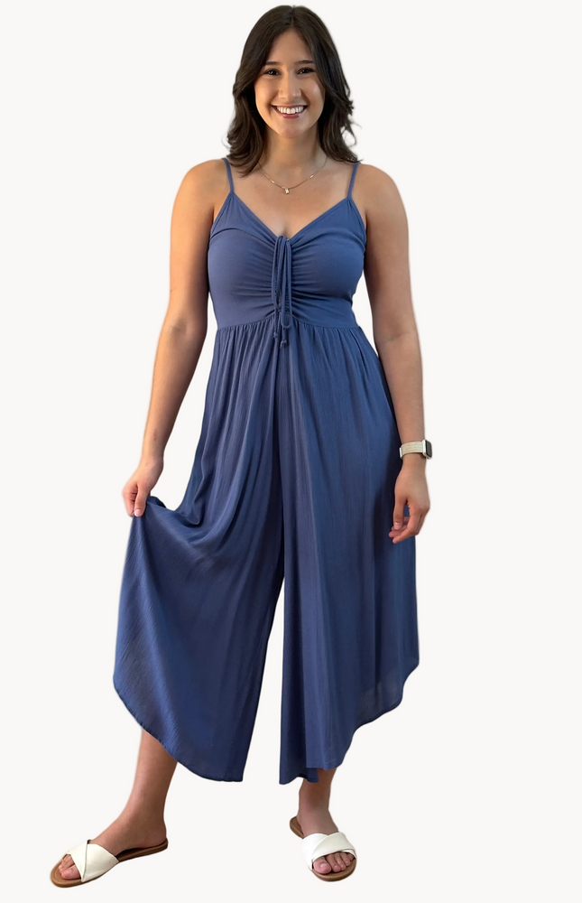 Isla Jumpsuit — woven solid fabric with ruched front and round midi hemline from Justyna Grace Boutique.