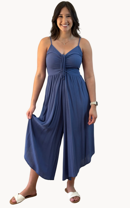 Isla Jumpsuit — woven solid fabric with ruched front and round midi hemline from Justyna Grace Boutique.