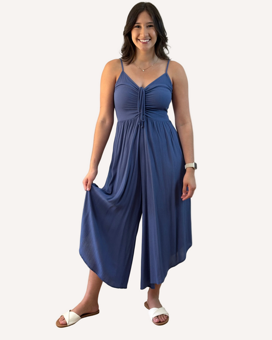 Isla Jumpsuit — woven solid fabric with ruched front and round midi hemline from Justyna Grace Boutique.