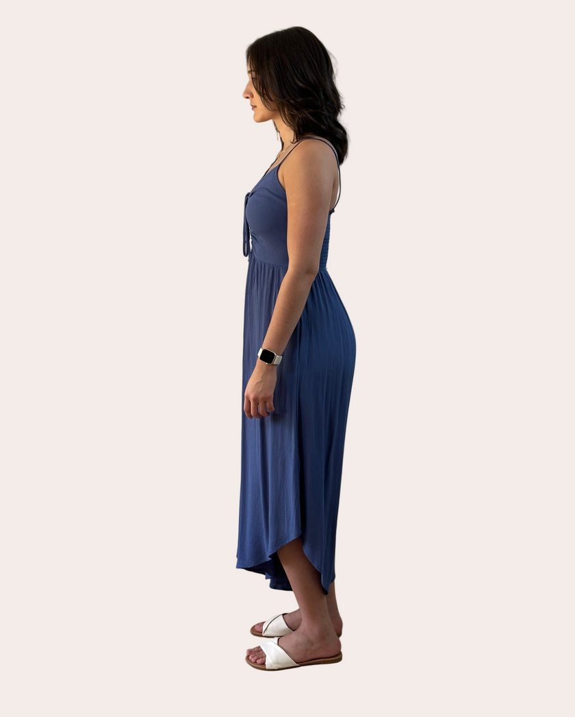 Isla Jumpsuit — woven solid fabric with ruched front and round midi hemline from Justyna Grace Boutique.