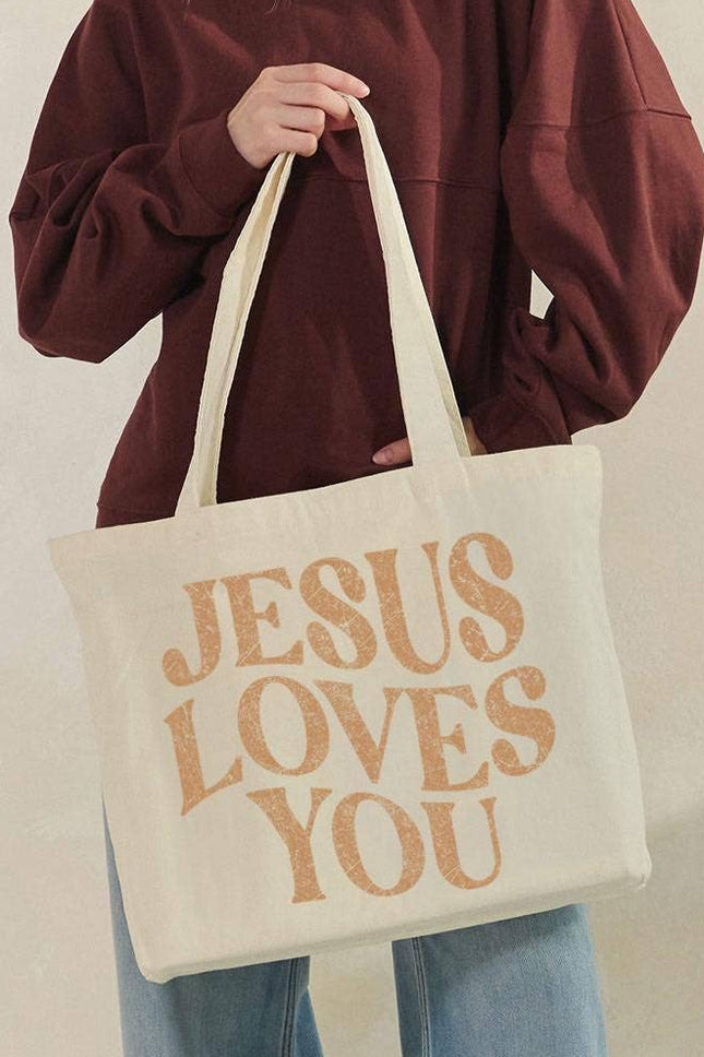 Jesus Loves You canvas tote bag front view with bold faith graphic