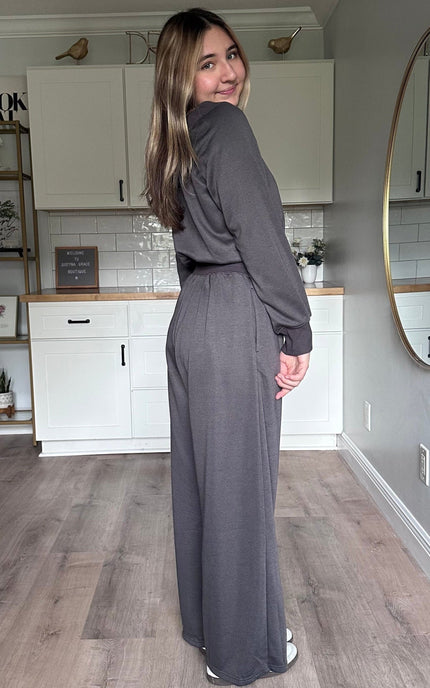 Side view of the Juliet wide-neck jumpsuit showing relaxed silhouette and lightweight knit fabric