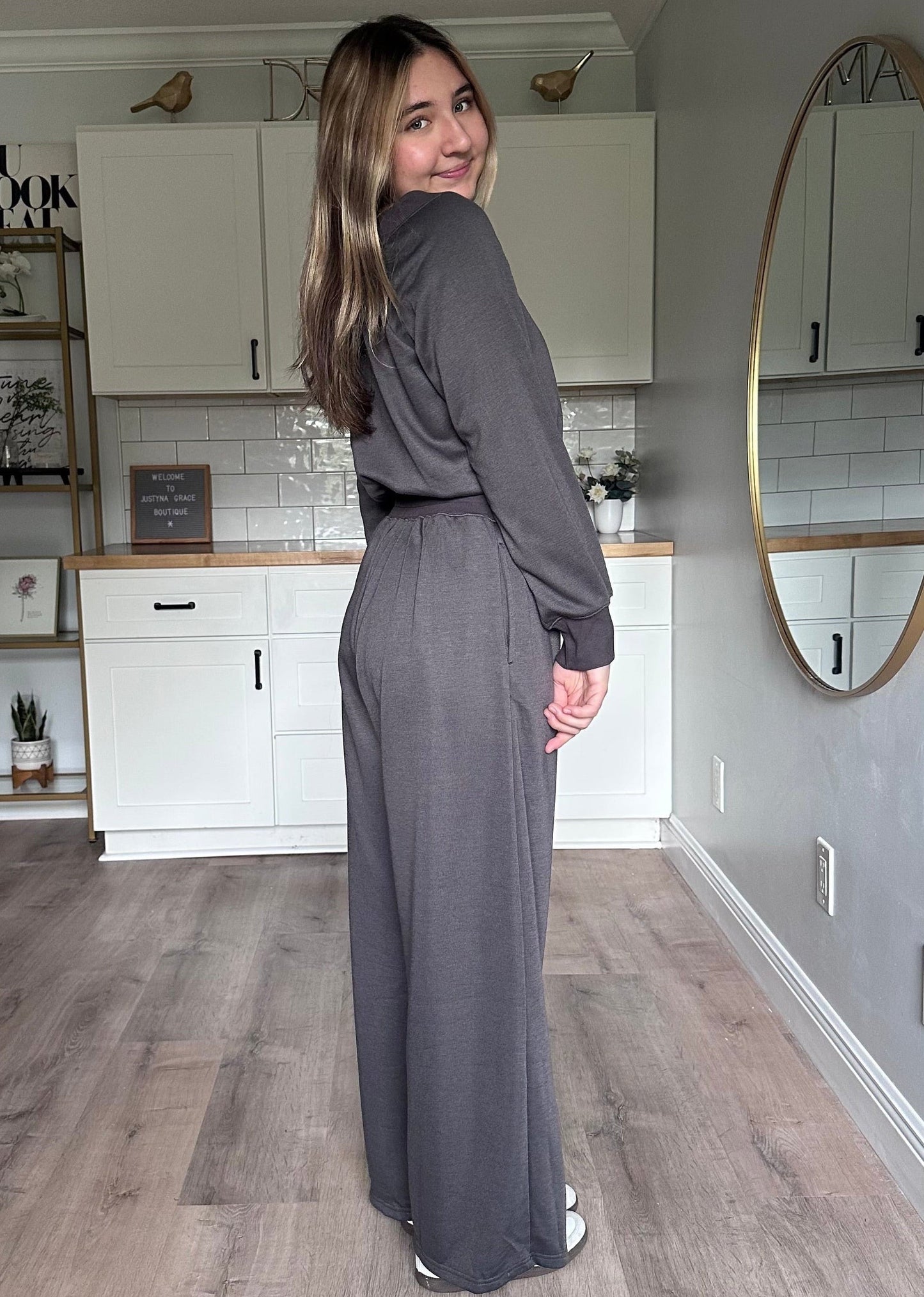 Side view of the Juliet wide-neck jumpsuit showing relaxed silhouette and lightweight knit fabric