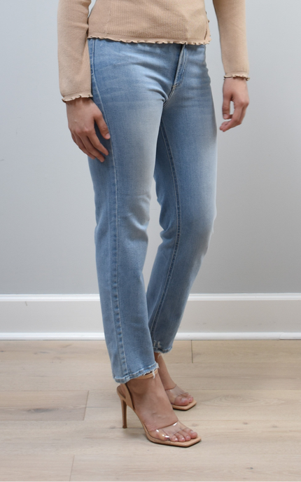 Side view of light-wash straight-leg jeans highlighting the mid-high 10.5” rise and smooth hip fit.