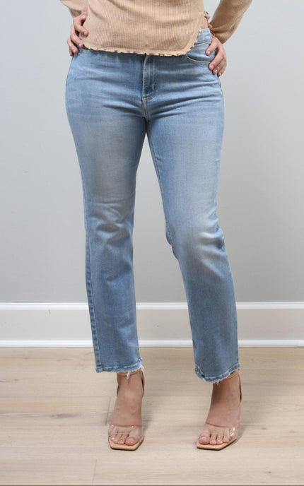 Light-wash straight-leg jeans with mid-high rise shown from the front on model, styled with neutral top.