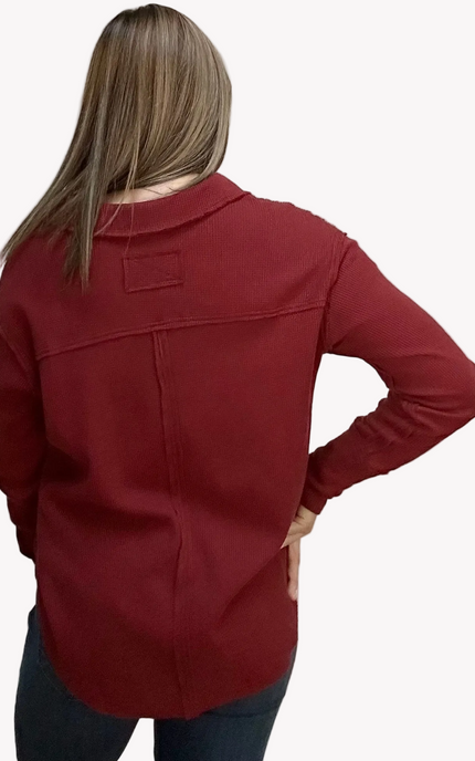 Autumn Ridge Polo long sleeve top in thermal cotton-blend fabric – split V-neckline with soft collar – front view on soft linen background – Justyna Grace Boutique