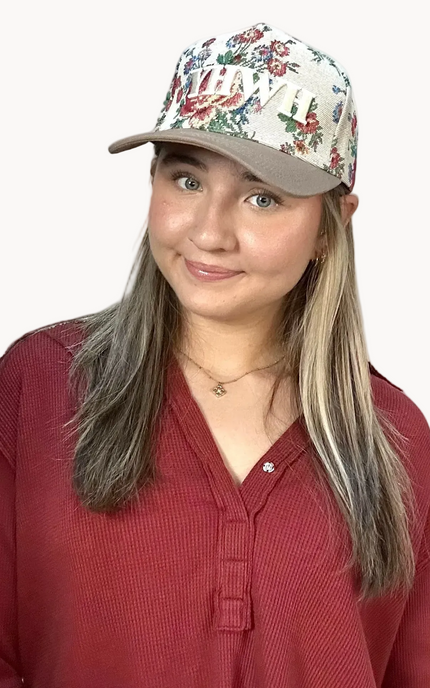YHWH embroidered floral hat with brown bill and white stitching – adjustable unisex cotton snapback – one-of-a-kind floral pattern – front view on soft linen background – Justyna Grace Boutique