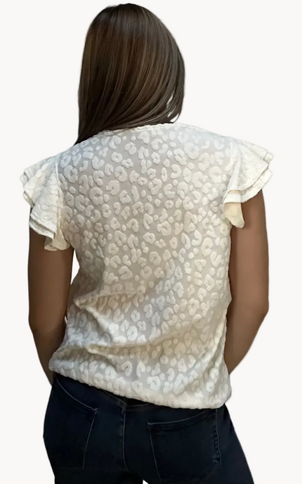 Louisiana Top with subtle tonal animal-print texture, soft ruffle sleeves, and V-neckline – lightweight relaxed silhouette – front view on soft linen background – Justyna Grace Boutique