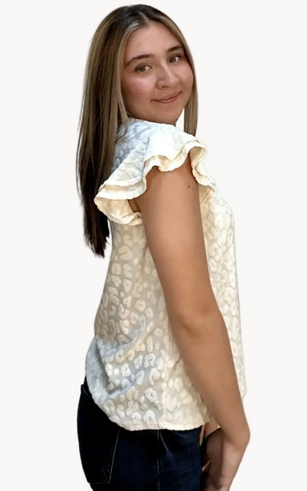 Louisiana Top with subtle tonal animal-print texture, soft ruffle sleeves, and V-neckline – lightweight relaxed silhouette – front view on soft linen background – Justyna Grace Boutique