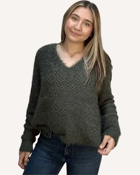 Plush popcorn-texture V-neck sweater with relaxed fit and hi-low hem – fuzzy soft knit in a gently draped silhouette – front view on soft linen background – Justyna Grace Boutique