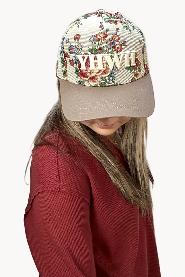 YHWH embroidered floral hat with brown bill and white stitching – adjustable unisex cotton snapback – one-of-a-kind floral pattern – front view on soft linen background – Justyna Grace Boutique