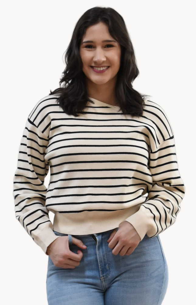 Justyna Top on soft linen background, featuring a soft knit long sleeve and asymmetric boat neckline.