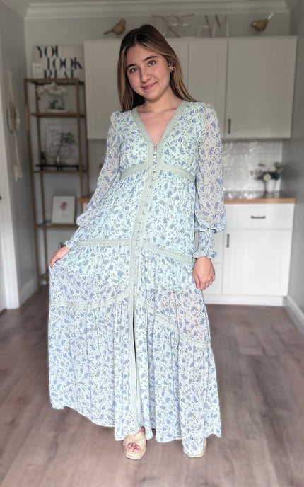 Leah floral lace trim maxi dress with flowing silhouette, covered button front, and romantic floral chiffon