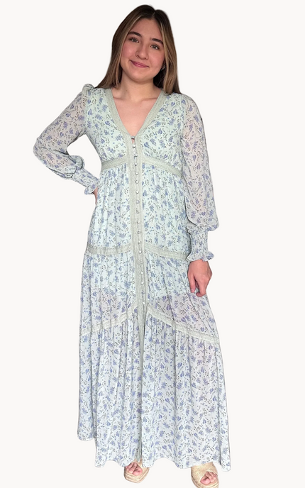 Woman wearing a floral dress with a white background