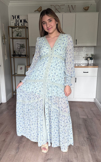 Leah floral lace trim maxi dress with flowing silhouette, covered button front, and romantic floral chiffon