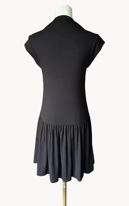 Black knit mini dress with soft drape hem and short sleeves — minimalist modern silhouette from Justyna Grace Boutique