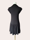 Black knit mini dress with soft drape hem and short sleeves — minimalist modern silhouette from Justyna Grace Boutique