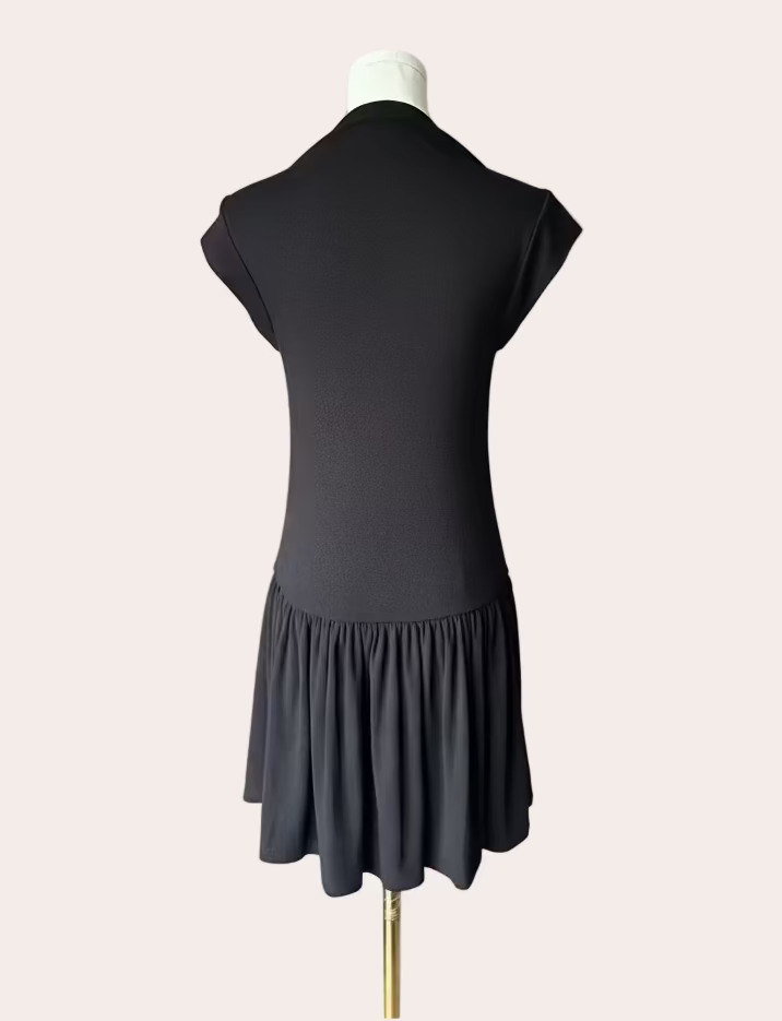 Black knit mini dress with soft drape hem and short sleeves — minimalist modern silhouette from Justyna Grace Boutique