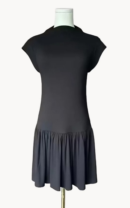 Black knit mini dress with soft drape hem and short sleeves — minimalist modern silhouette from Justyna Grace Boutique.