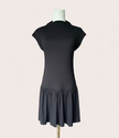 Black knit mini dress with soft drape hem and short sleeves — minimalist modern silhouette from Justyna Grace Boutique.
