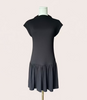 Black knit mini dress with soft drape hem and short sleeves — minimalist modern silhouette from Justyna Grace Boutique.