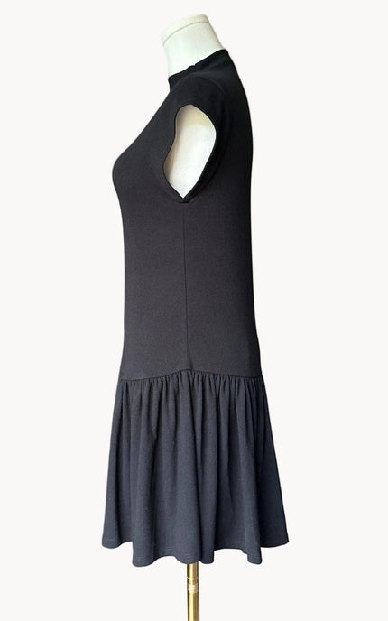 Black knit mini dress with soft drape hem and short sleeves — minimalist modern silhouette from Justyna Grace Boutique