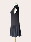 Black knit mini dress with soft drape hem and short sleeves — minimalist modern silhouette from Justyna Grace Boutique