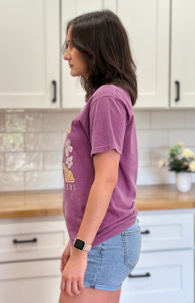 Vintage-style “Love Like Jesus” floral graphic tee with soft cotton feel and relaxed fit.