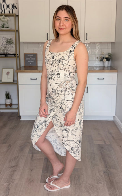 Model wearing Lydia square neck midi dress with smocked back waist and wrap style fit