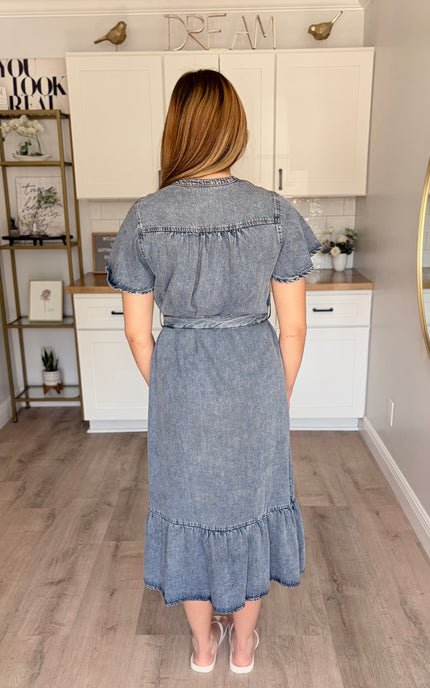Model wearing Maeve Tencel midi dress with split neckline and ruffled hem
