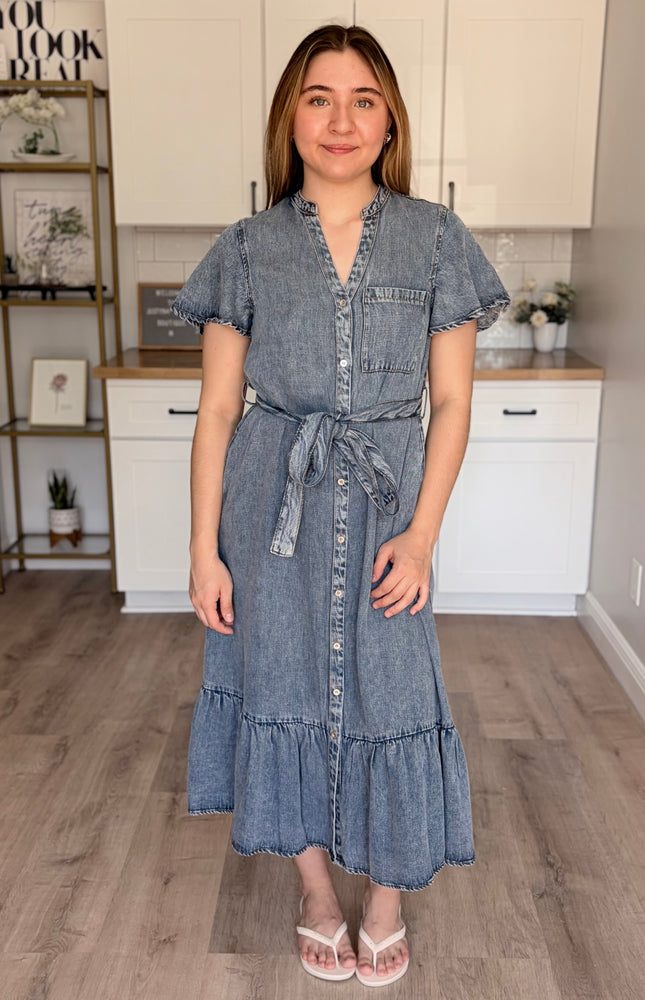 Model wearing Maeve Tencel midi dress with split neckline and ruffled hem