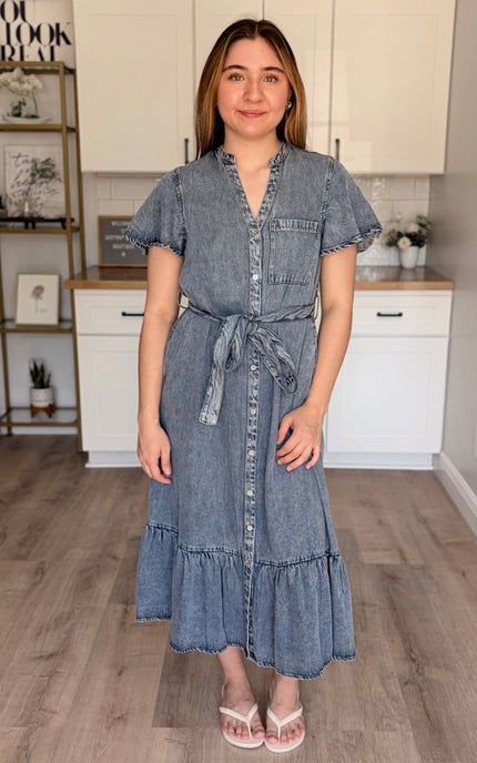 Model wearing Maeve Tencel midi dress with split neckline and ruffled hem