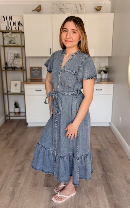 Model wearing Maeve Tencel midi dress with split neckline and ruffled hem