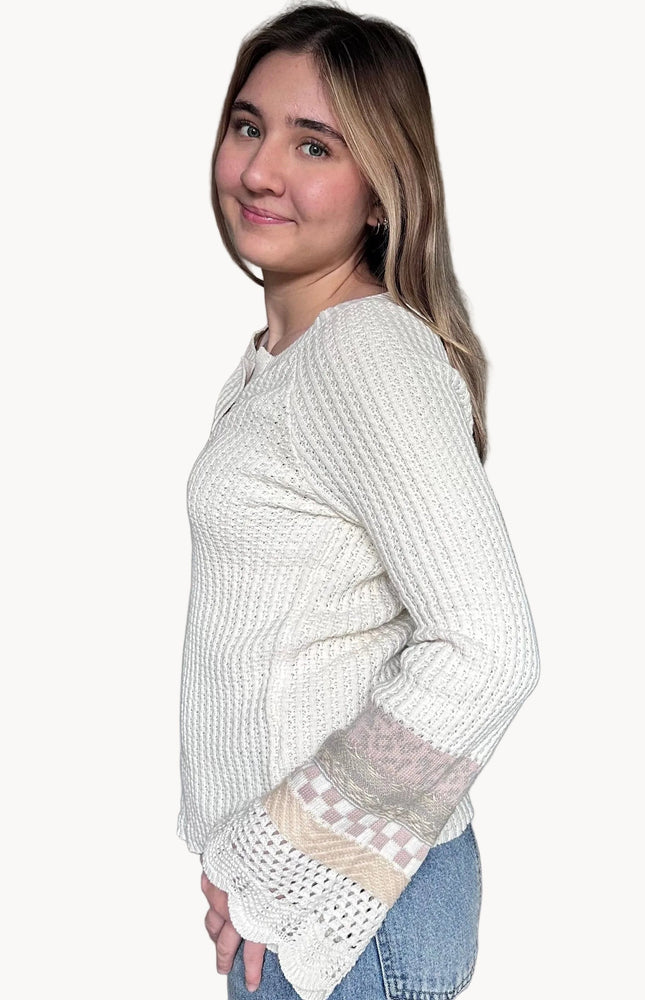 Side view of the Margot mixed sleeve sweater showing relaxed fit and soft knit texture