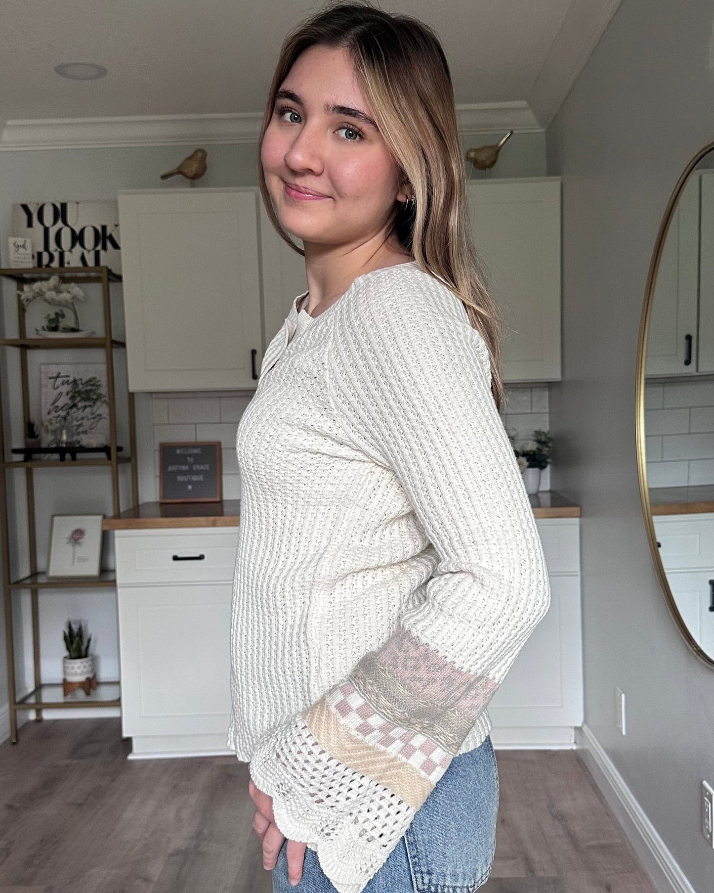 Side view of the Margot mixed sleeve sweater showing relaxed fit and soft knit texture