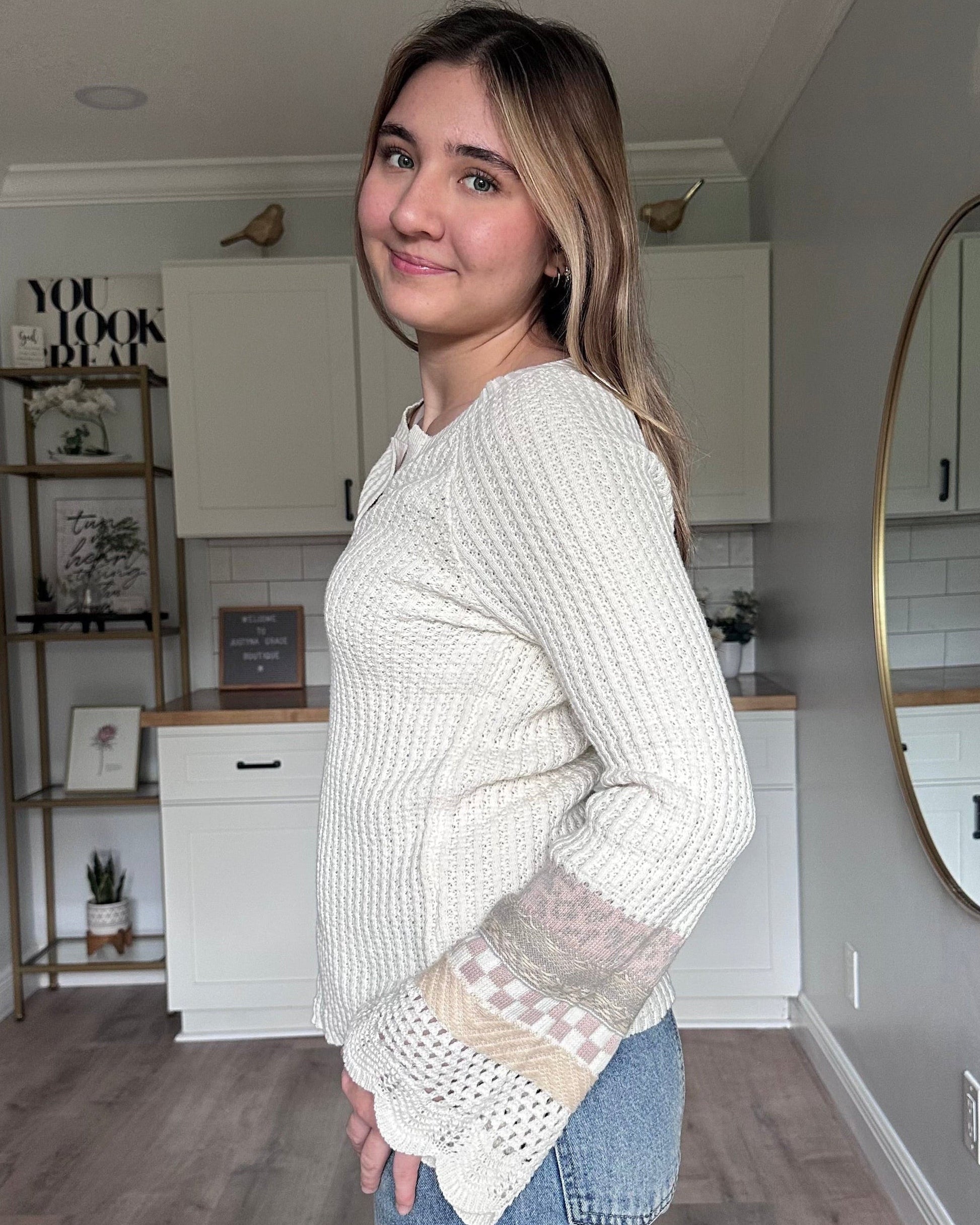 Side view of the Margot mixed sleeve sweater showing relaxed fit and soft knit texture