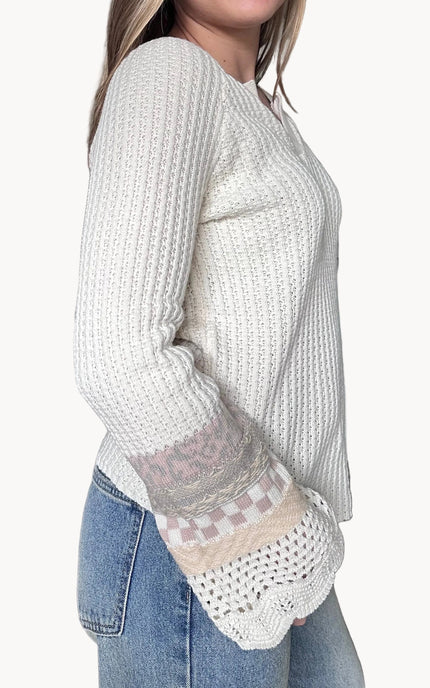 Side view of the Margot mixed sleeve sweater showing relaxed fit and soft knit texture
