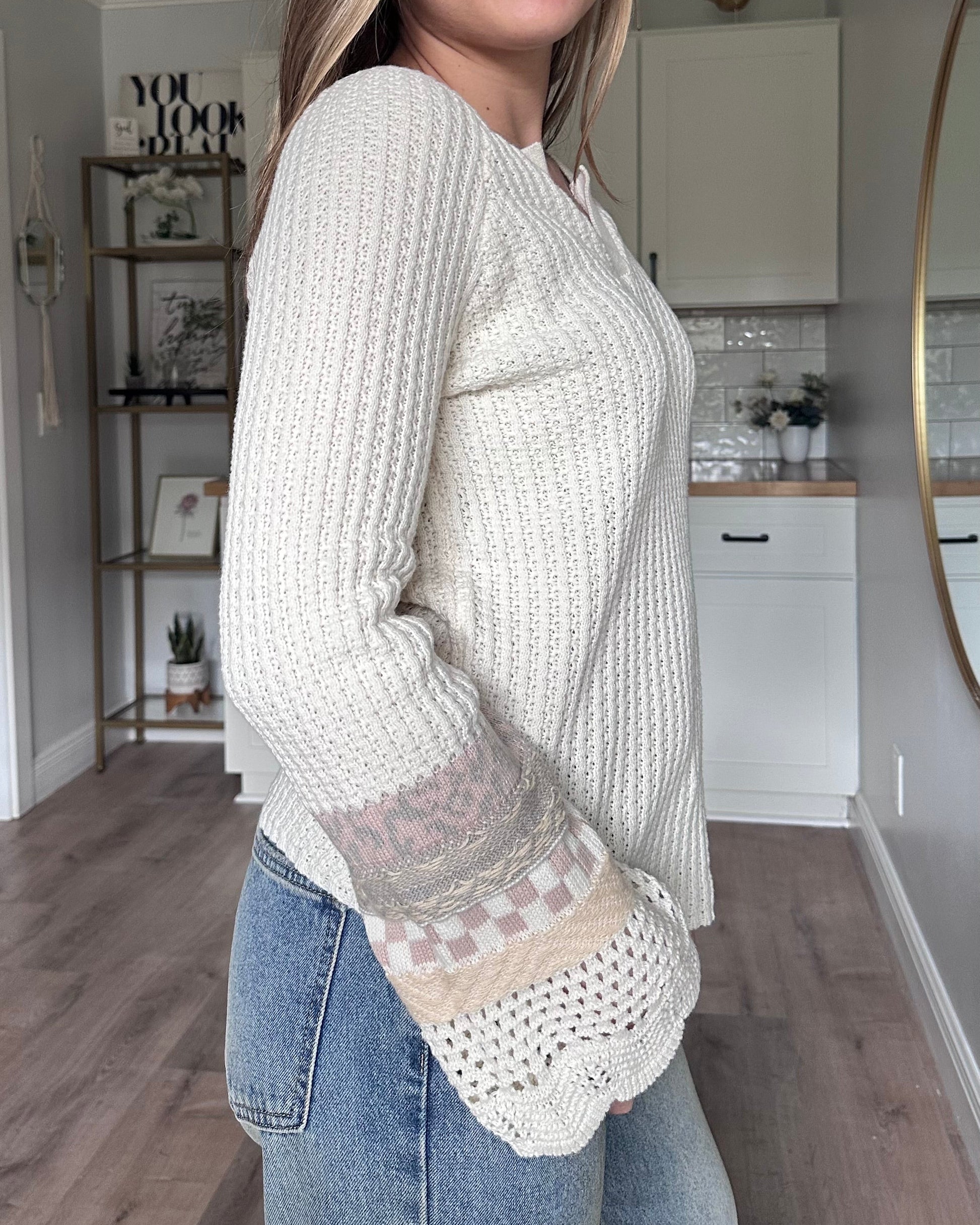Side view of the Margot mixed sleeve sweater showing relaxed fit and soft knit texture
