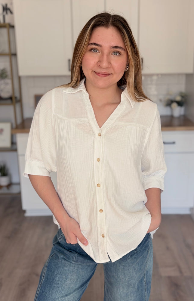 Model wearing Marin cotton gauze button down shirt with relaxed fit and half sleeves